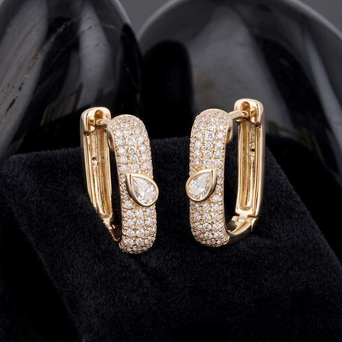 Pear Cut Accent Pave Diamond Huggie Earrings in 14K Yellow Gold