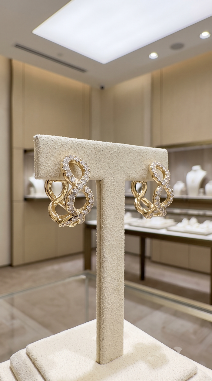 Infinity Twist Diamond Huggie Earrings in 14K Yellow Gold