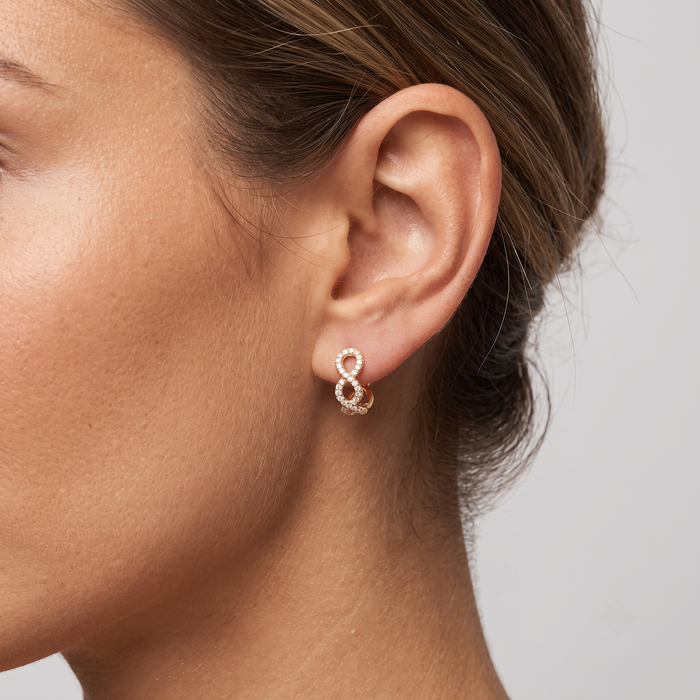 Infinity Twist Diamond Huggie Earrings in 14K Yellow Gold