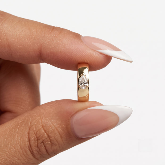 Teardrop Pear Shape Diamond Huggie Earrings in 14K Yellow Gold