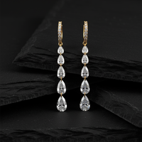 Cascading Pear Shape Drilled Diamonds Drop Earrings in 14K Gold