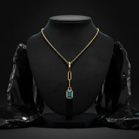 Orbit Blue Topaz Pendant Necklace in 14K Yellow Gold