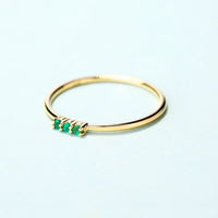 Trilogy Round Emerald Ring in 14K Yellow Gold
