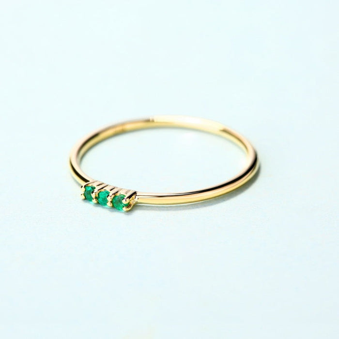Trilogy Round Emerald Ring in 14K Yellow Gold