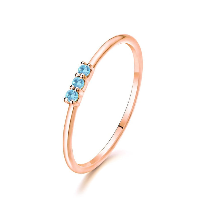 Trilogy Round Aquamarine Ring in 14K Rose Gold