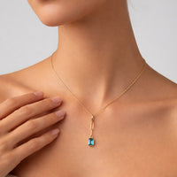 Orbit Blue Topaz Pendant Necklace in 14K Yellow Gold