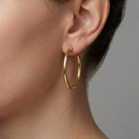 Polished Classic Medium Hoop Earrings in 14K Gold