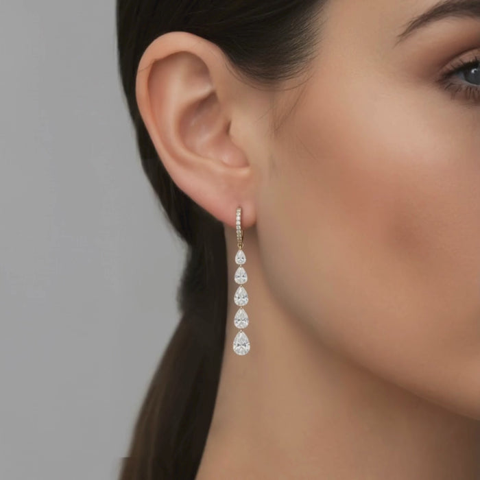 Cascading Pear Shape Drilled Diamonds Drop Earrings in 14K Gold